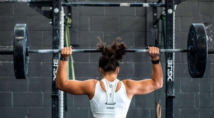 Woman benching in the gym